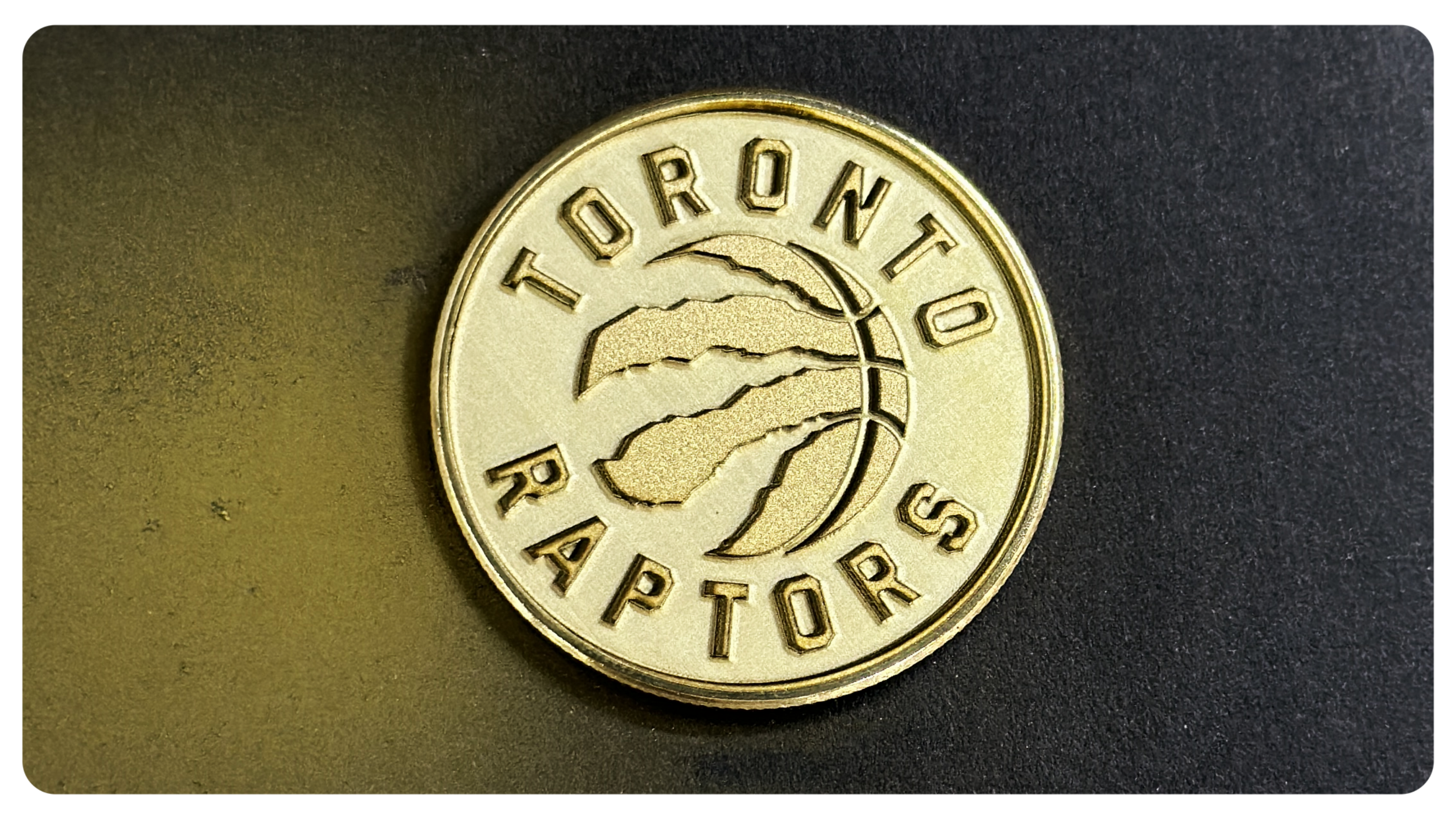 Laser engraved deeply on brass coin